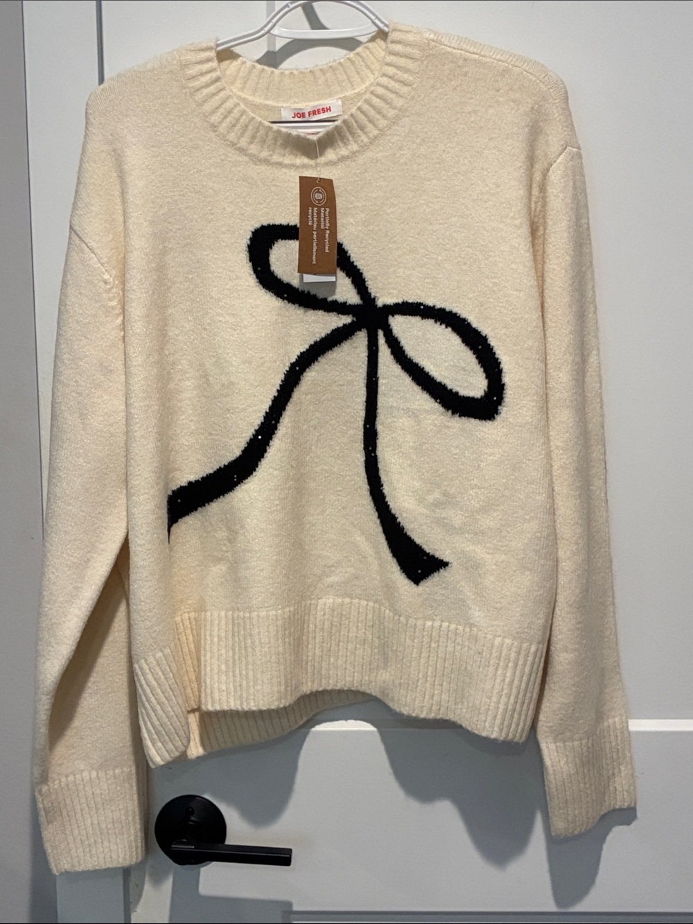 Joe Fresh Cream Crewneck Sweater with Black Bow Motif. B32